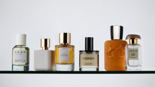 A variety of perfume bottles against a white backdrop