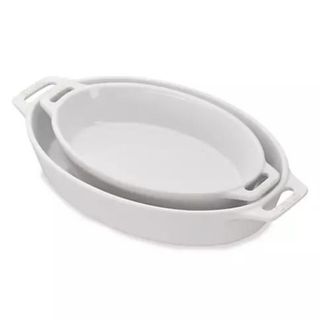 white oval dishes from saks on a white background