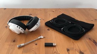 Master Dynamic MG20 headset on wooden surface