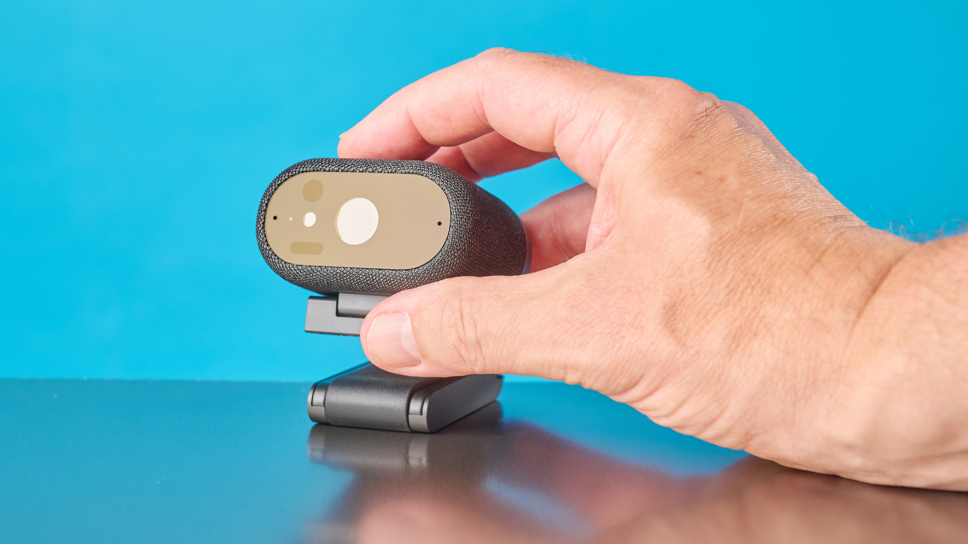 Dell Pro 7 Webcam photographed in front of a blue background