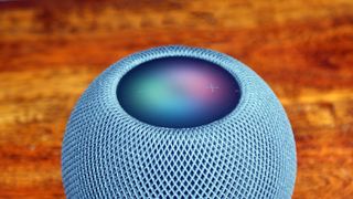 A close up of the Apple HomePod mini wireless speaker