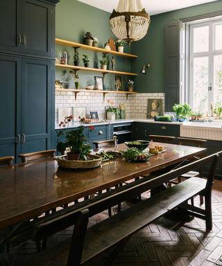 painted kitchen with wooden table
