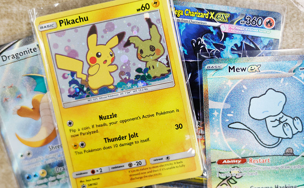Collectable Pok&eacute;mon cards arranged on a table