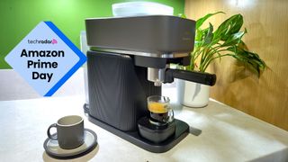 A black Philips Baristina espresso machine on a kitchen counter, with an Amazon Prime Day deal badge on the left.