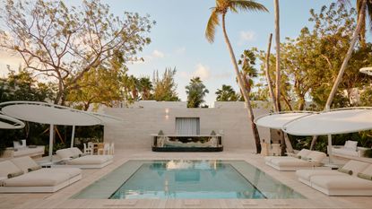 Palm Heights Hotel Spa pool with loungers and sunshades