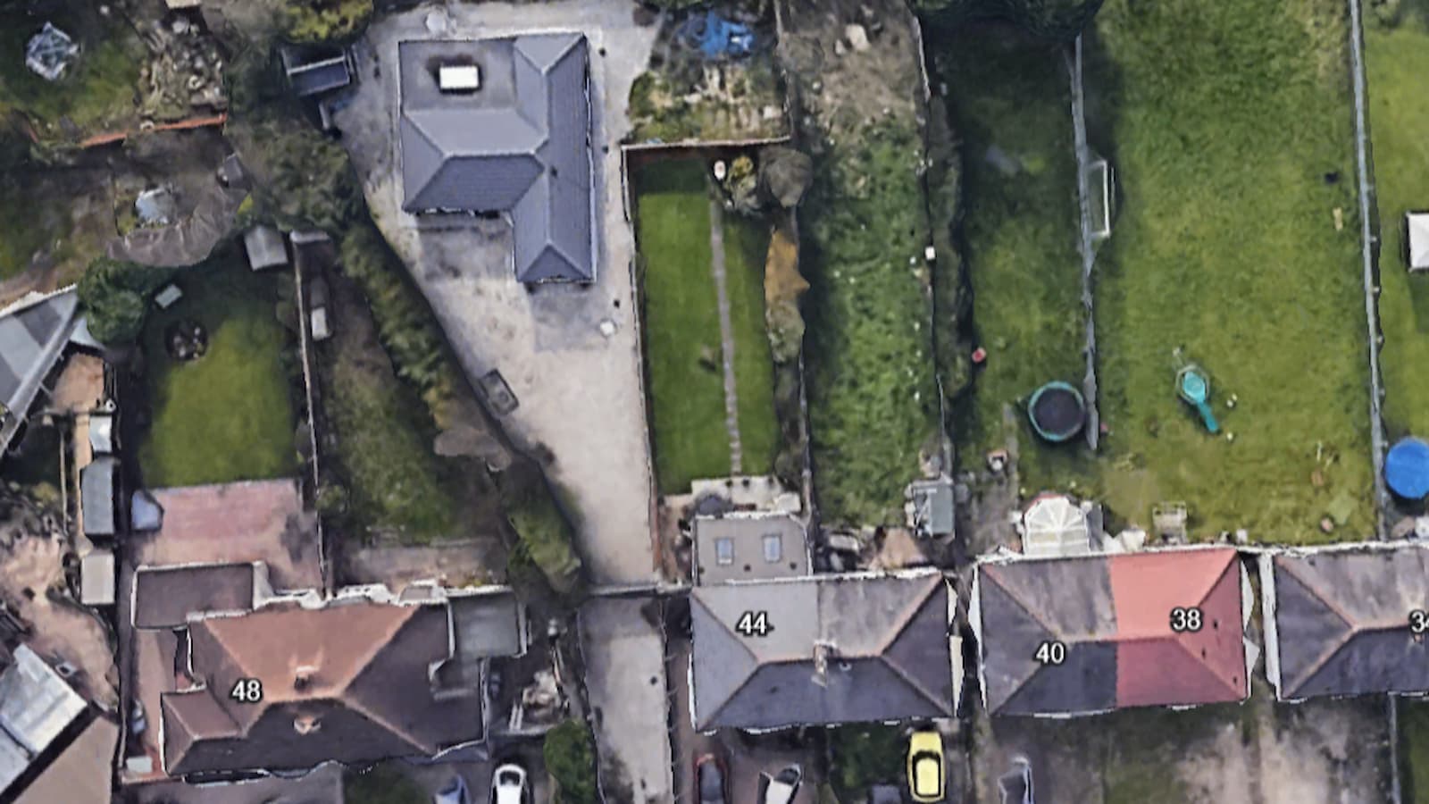 An aerial photo of a bungalow in a garden