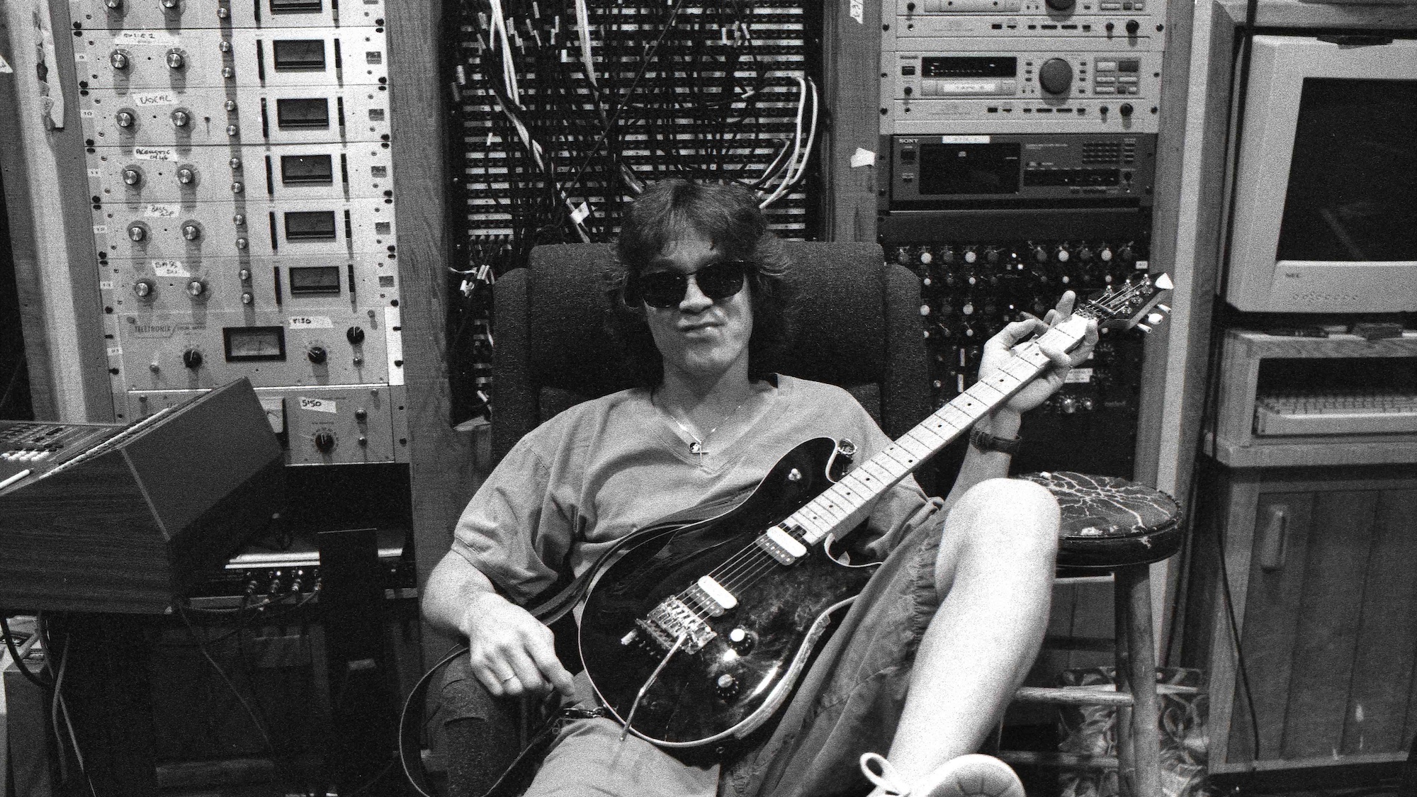 Eddie Van Halen, pictured seated in a chair at 5150 Studios