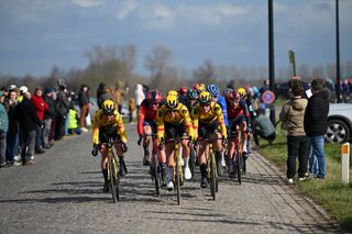 Jumbo-Visma massed at the front of the peloton as they hit a cobbled sector at Omloop Het Nieuwsblad