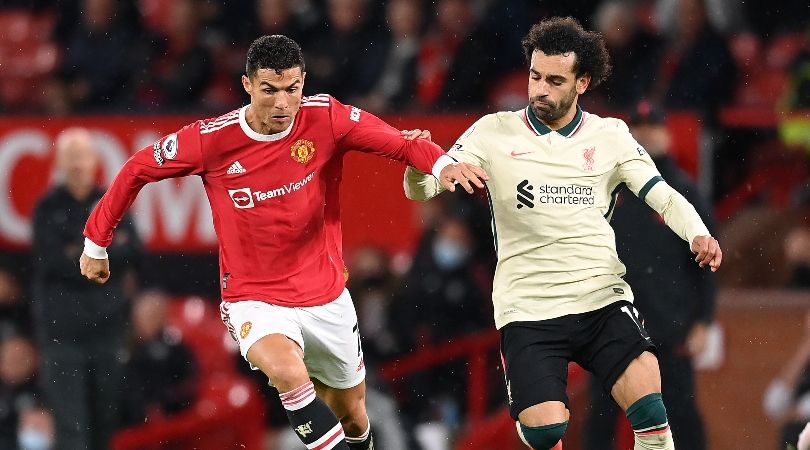 Cristiano Ronaldo of Manchester United challenges Liverpool&#039;s Mohamed Salah.