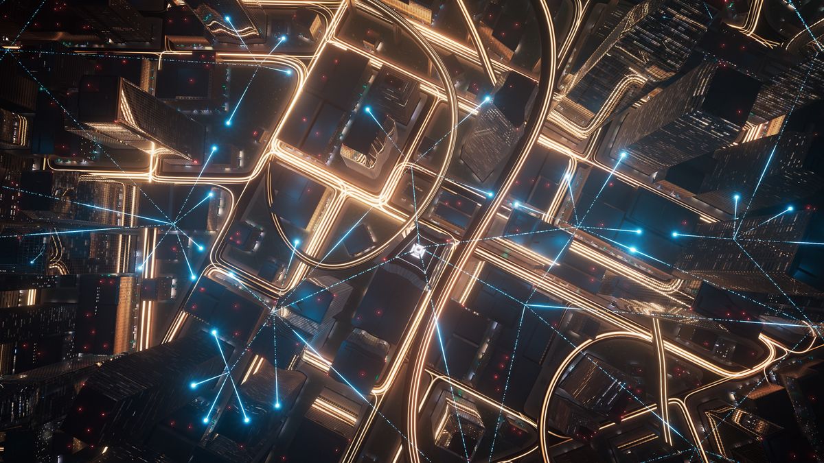 A CGI render of a smart city, shown at night from above. Each skyscraper is connected to others by glowing blue lines representing data.