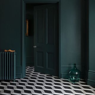 dark hallway with patterned geometric tiles