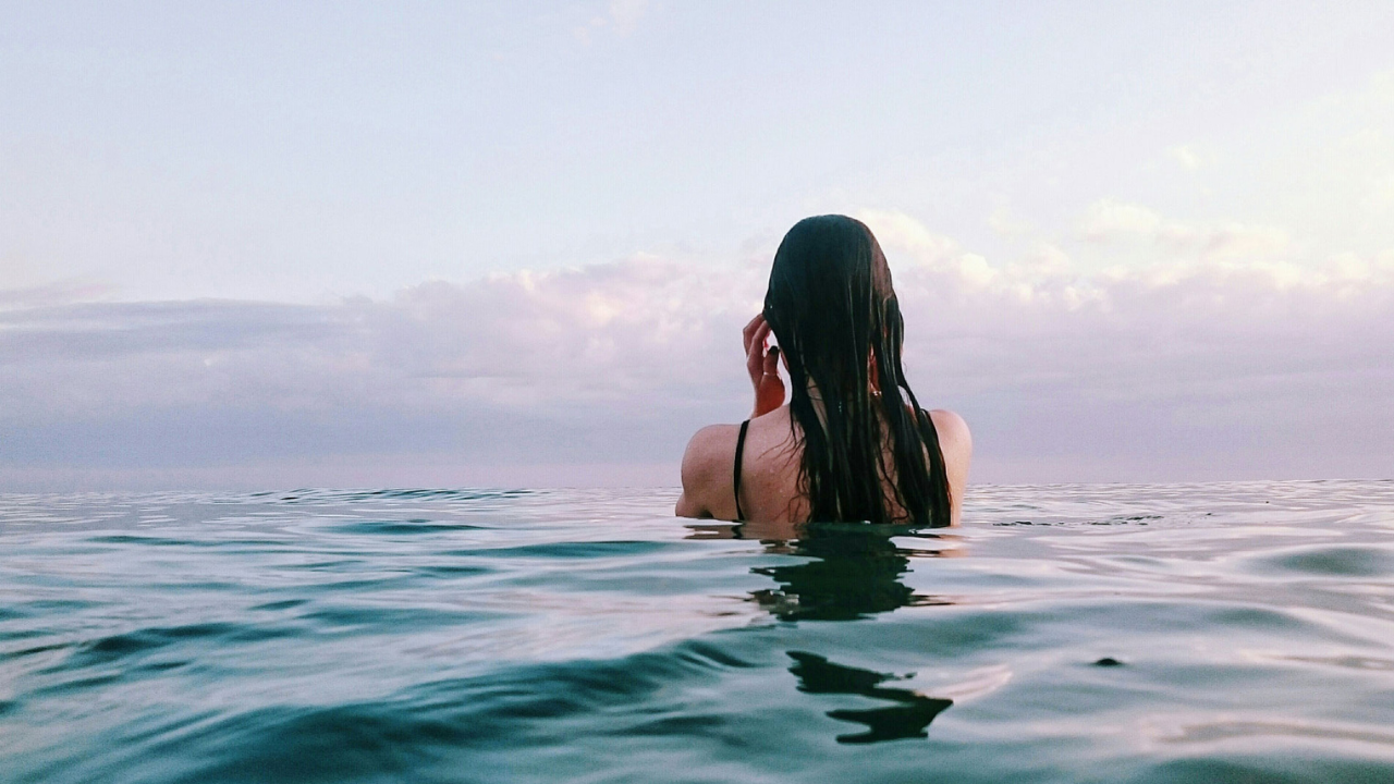 woman wild swimming in the sea