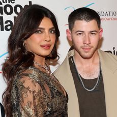 Priyanka Chopra in a sheer Dolce & Gabbana robe and Nick Jonas in a beige khaki suit at 'The Good Half' premiere in Los Angeles August 2024