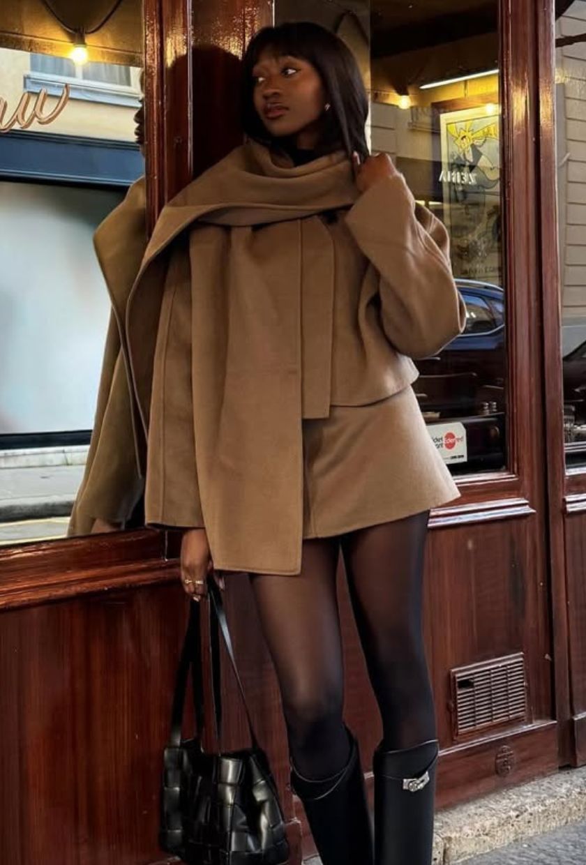 @emmanuellek_ wears a camel scarf jacket