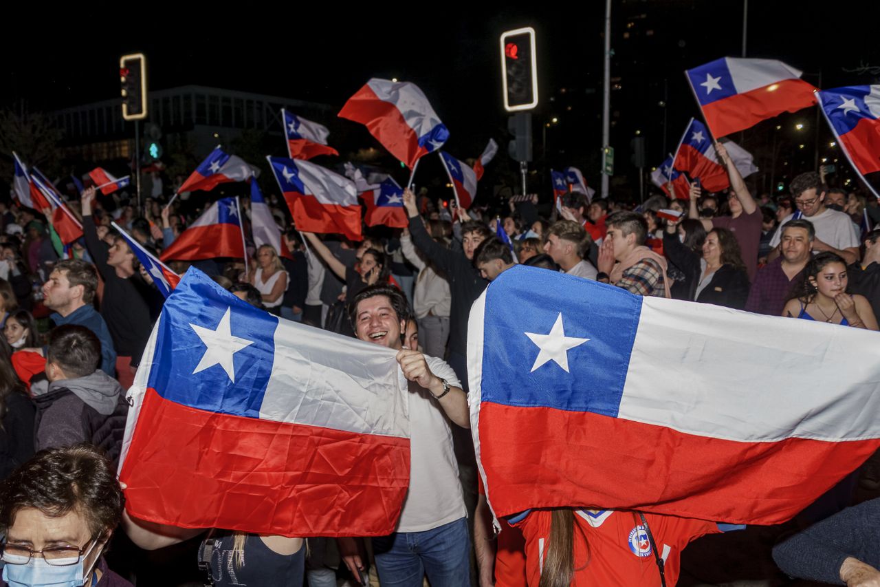 Demonstrators celebrate the rejection of a new constitution in Chile.