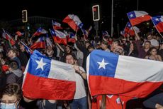 Demonstrators celebrate the rejection of a new constitution in Chile.