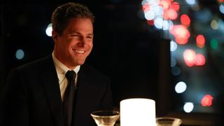 Ted Black (Stephen Amell) smiles at a bar over drinks in "Suits LA" episode 101