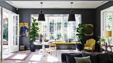 Dark grey living room with yellow accents