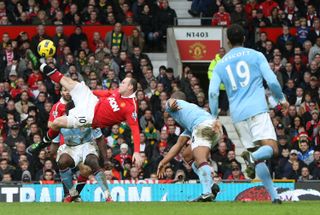 Wayne Rooney scores an overhead kick for Manchester United against Manchester City in February 2011.