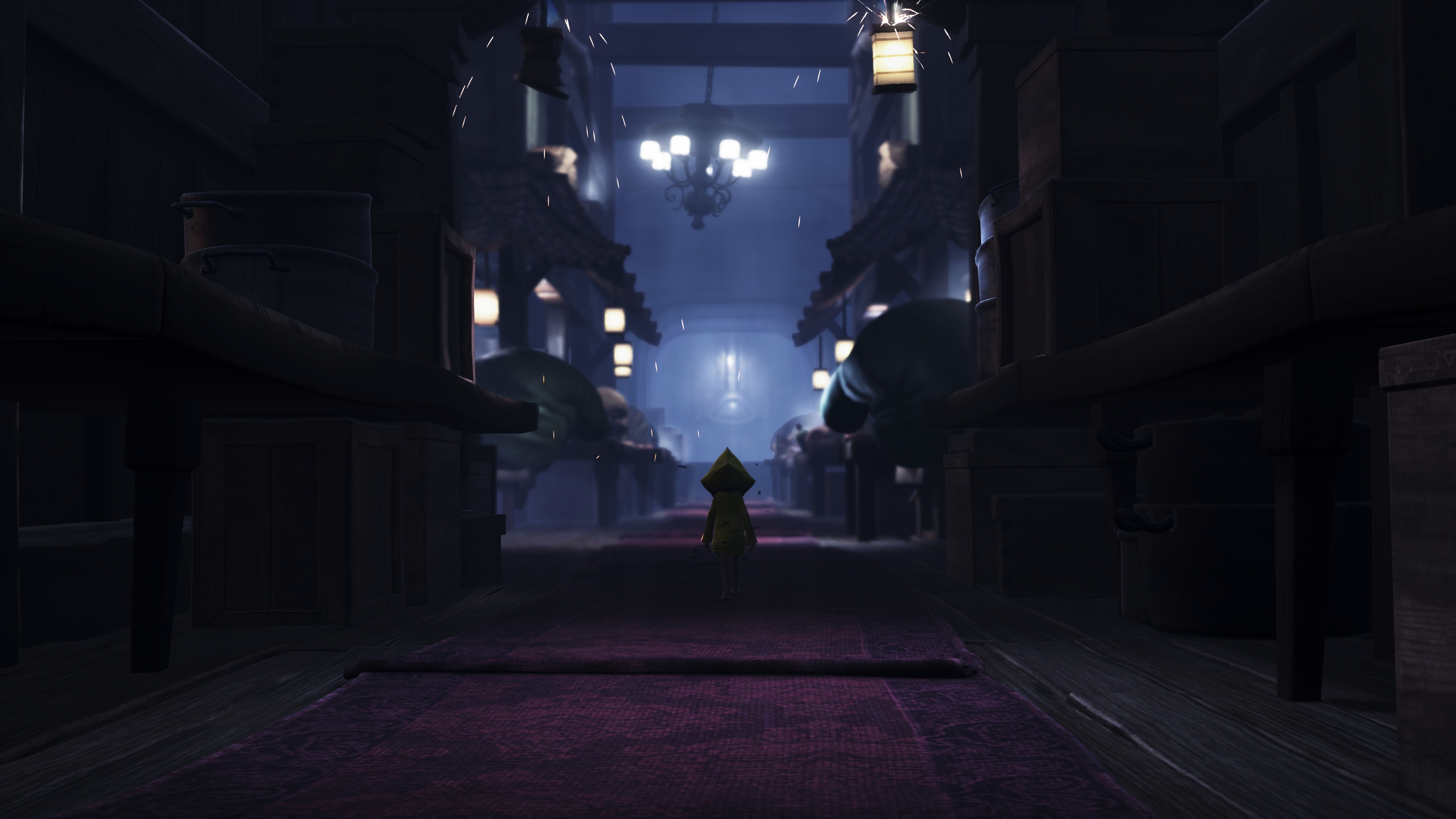 Little Nightmares-protagonisten Six går gjennom en mørklagt korridor.