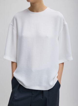 White women's t-shirt with trousers
