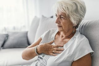 Senior woman holding her heart