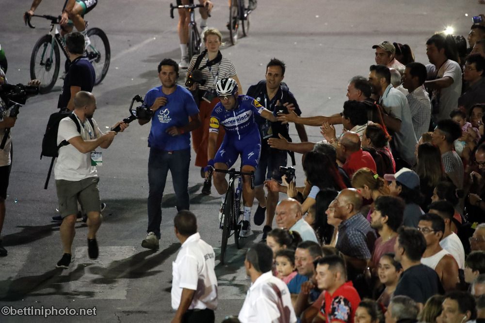 Max Richeze (Deceuninck-QuickStep) high-fives the crowd as he rides to the podium