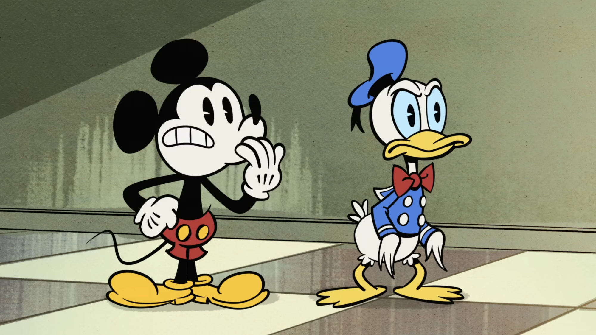 Mickey Mouse and Donald Duck look at Professor Ludwig Von Drake in a Mickey Mouse short.