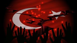 The epicenter of the earthquake in Turkey on a Turkey flag. Shadows of hands asking for help