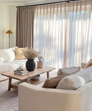voile window covering in living room with cream and neutral tones