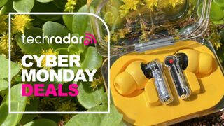 Nothing Ear (a) in foliage with words 'TechRadar Cyber Monday deals'