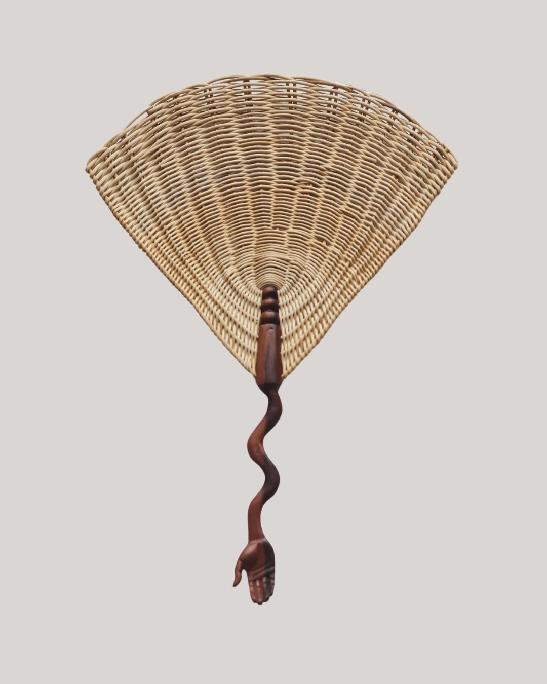 A van with a serpent-shaped hand handle in wood.