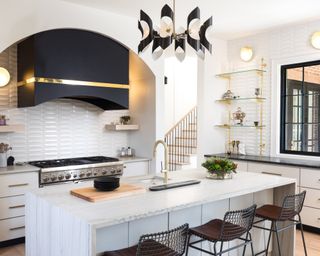 black and white kitchen with marble kitchen island by Maestri Studio