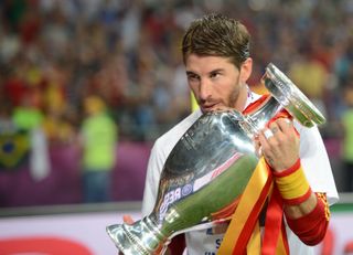 Sergio Ramos kisses the European Championship trophy after Spain's win over Italy in the final of Euro 2012.