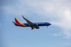 A Southwest Airlines plane in the sky. 