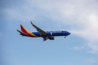 A Southwest Airlines plane in the sky. 