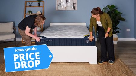 The DreamCloud Classic being inspected by two young women in a blue dorm room. A deals badge with the words "PRICE DROP" is seen in the bottom left hand corner.