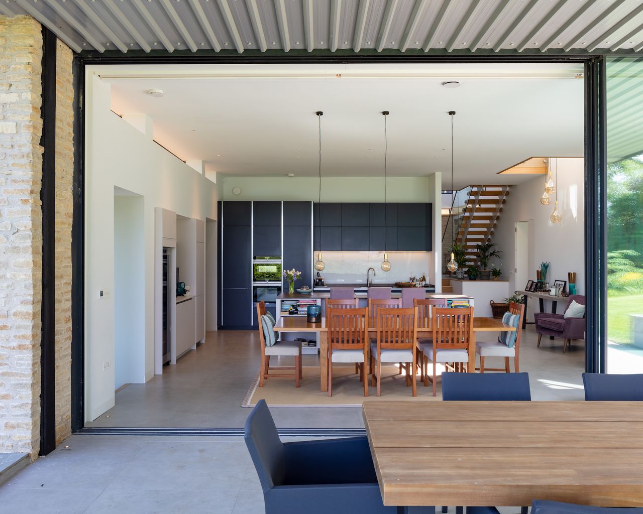 slliding glass doors leading to open plan kitchen diner