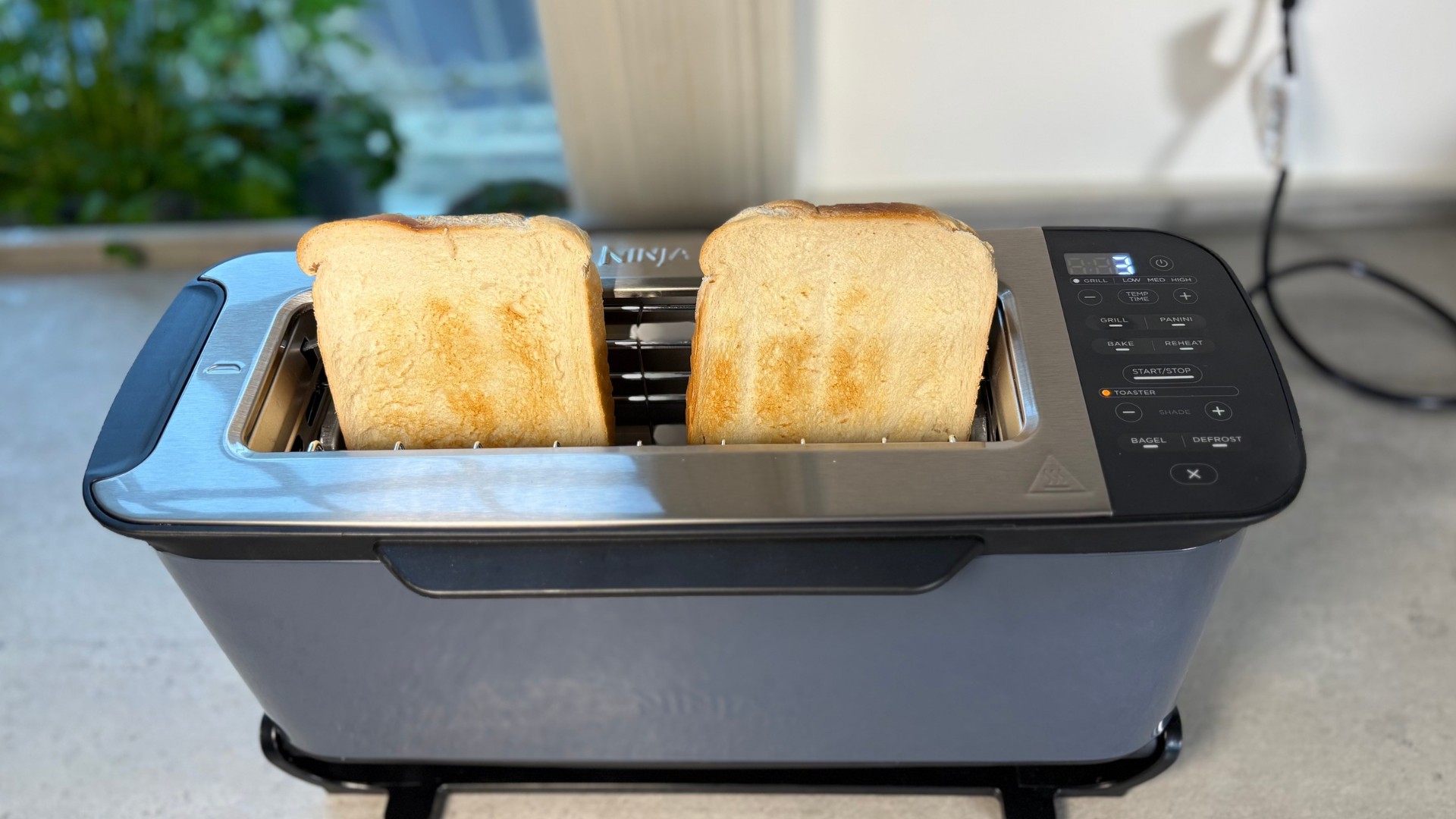 Testing the Ninja Foodi 3-in-1 Toaster Grill Panini Press on the counter toasting white bread