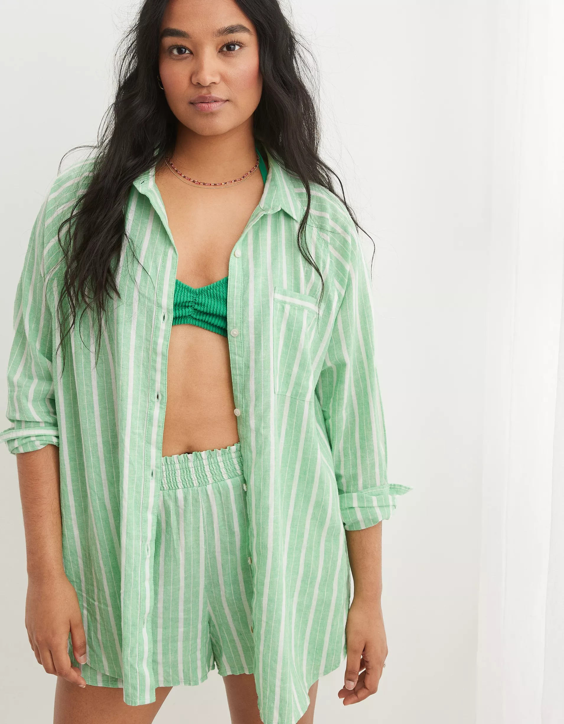 Model wearing green striped matching short set