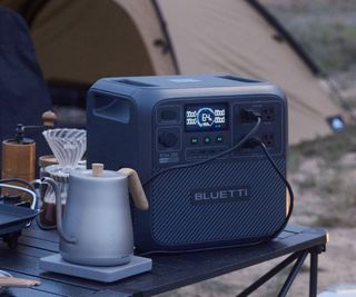 A Bluetti power station on a camp table