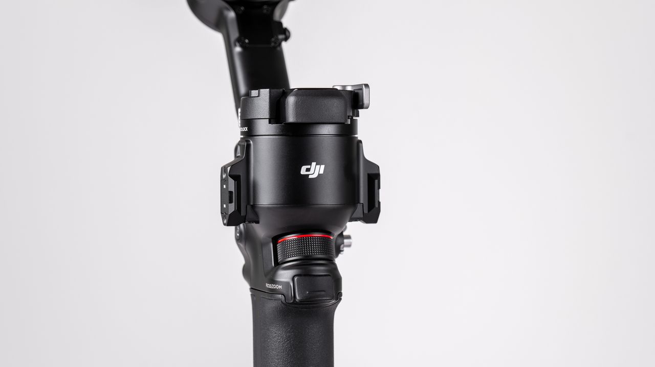 DJI RS 4 gimbal on a off-white background