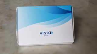 Image shows the packaging containing GlassesUSA Vista plus contact lenses..