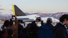 A photo of the XB-1 on the tarmac with a crowd of people around it