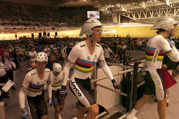 The Australian men's pursuit team steps onto the apron for their ride in the qualifying round.