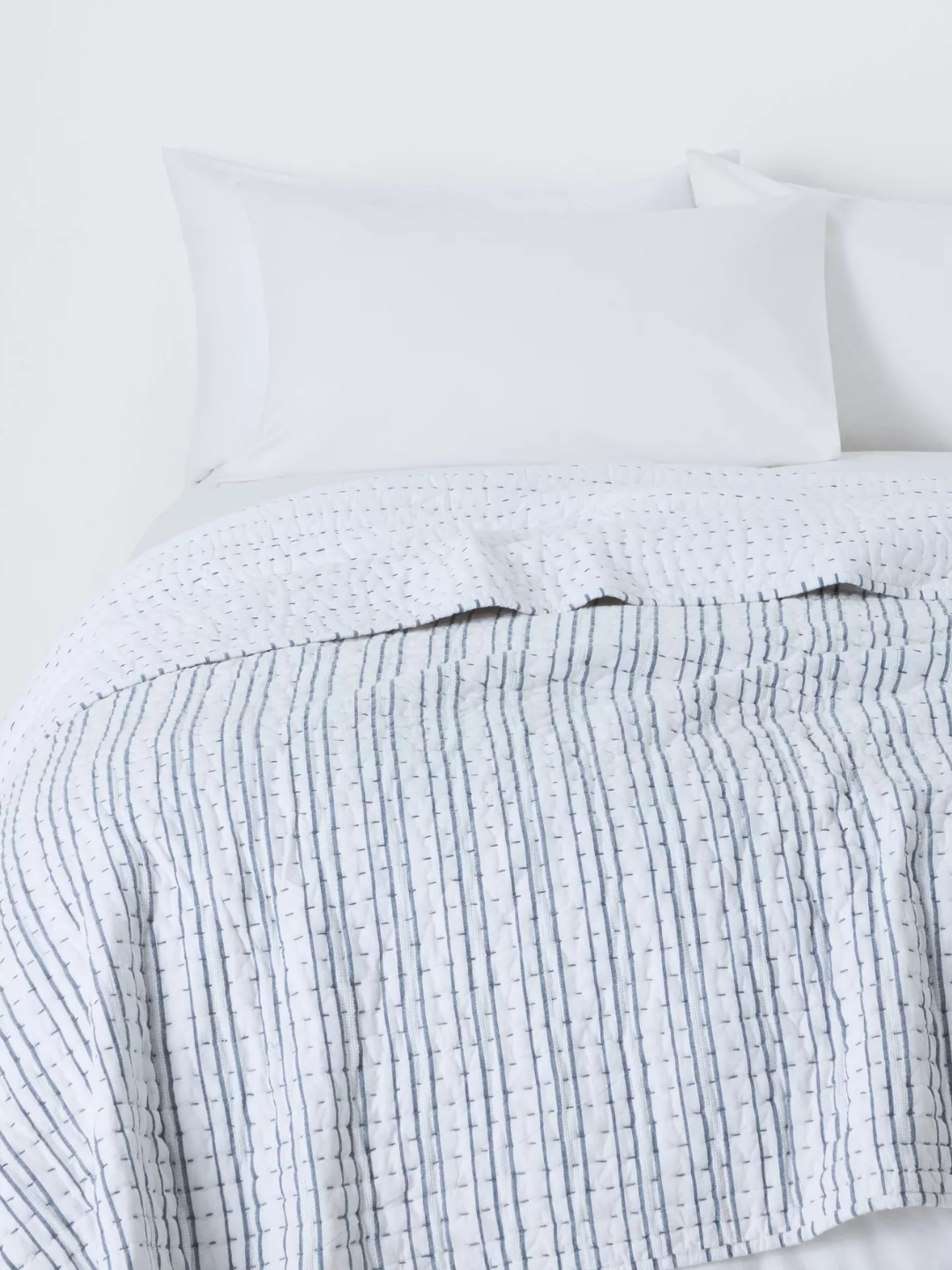 A blue and white striped quilt from John Lewis