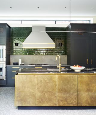 Small green kitchen tile ideas in a midnight blue kitchen scheme with gold accents.
