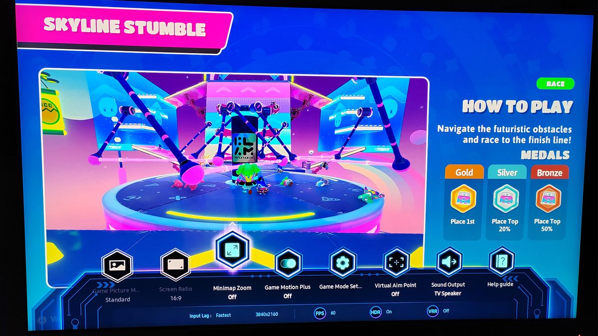 Samsung QN85C's game interface over a game of Fall Guys
