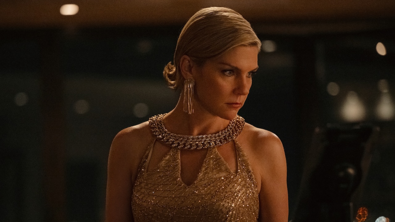 Carol dressed in fancy gold dress in Pluribus Season 1