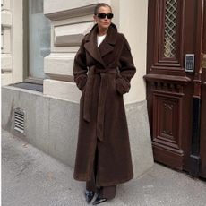 Woman in long brown coat